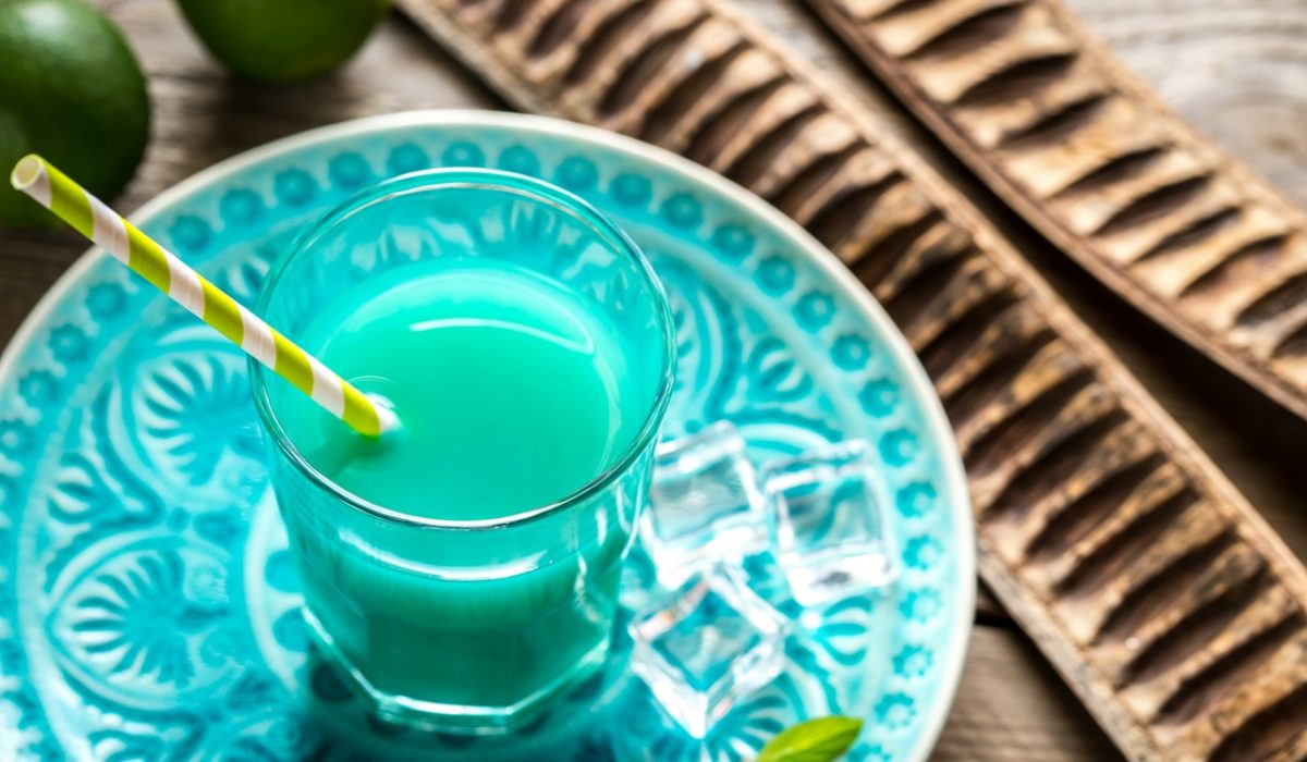 Glass of Blue Curacao and Juice Cocktail-min